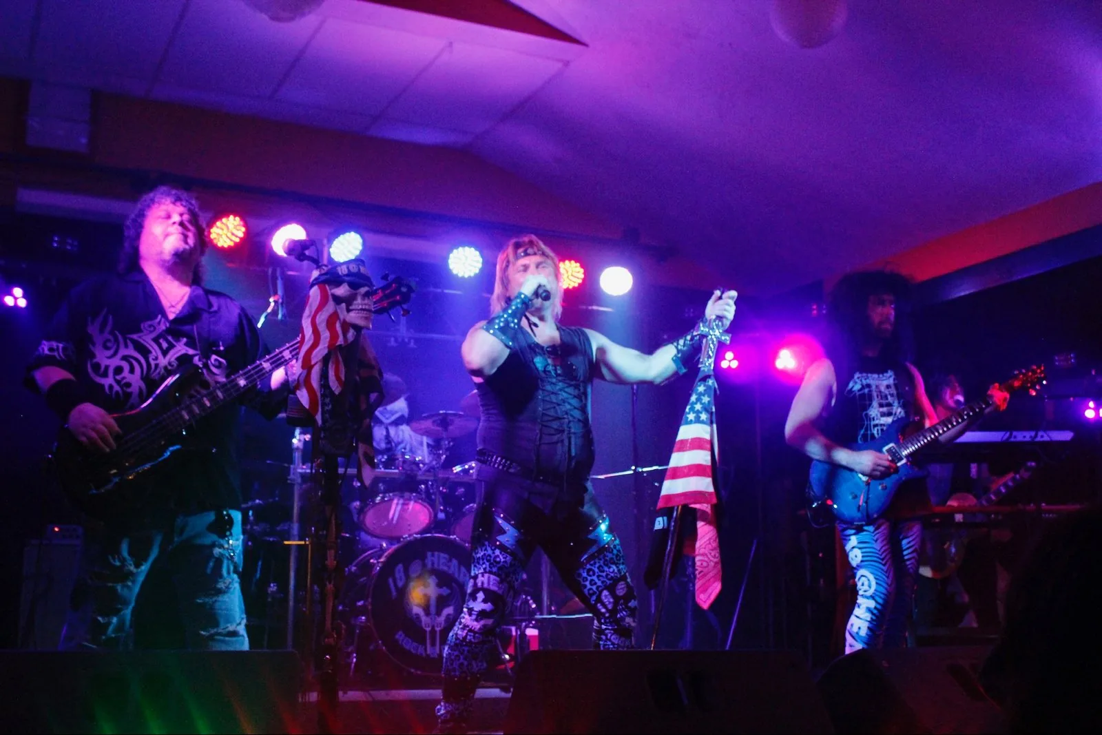 Wide shot of the full band performing